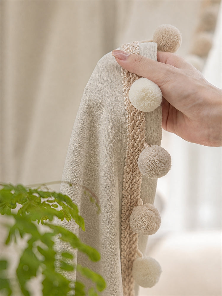 Close-up of the Maupassant chenille curtain pom-pom trim